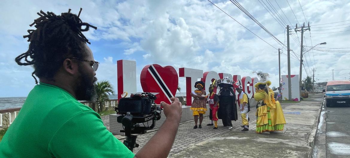 Caribbean carnival performers encourage communities to continue fight against COVID-19